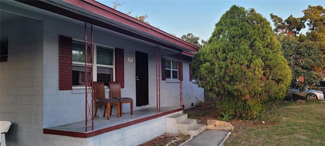 property entrance with a yard