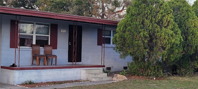 entrance to property with covered porch