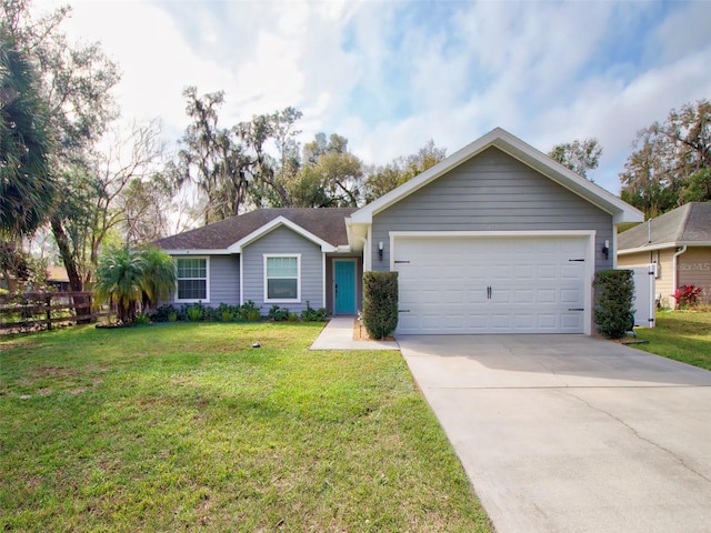 ranch-style house with a garage and a front yard