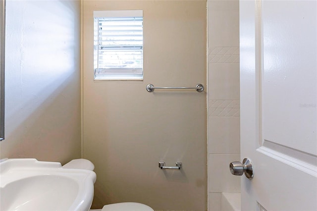 bathroom featuring toilet and a sink