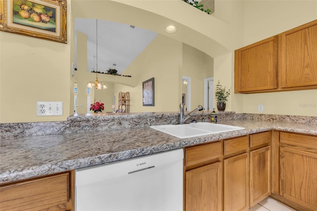 kitchen with a sink, a chandelier, dishwasher, and decorative light fixtures