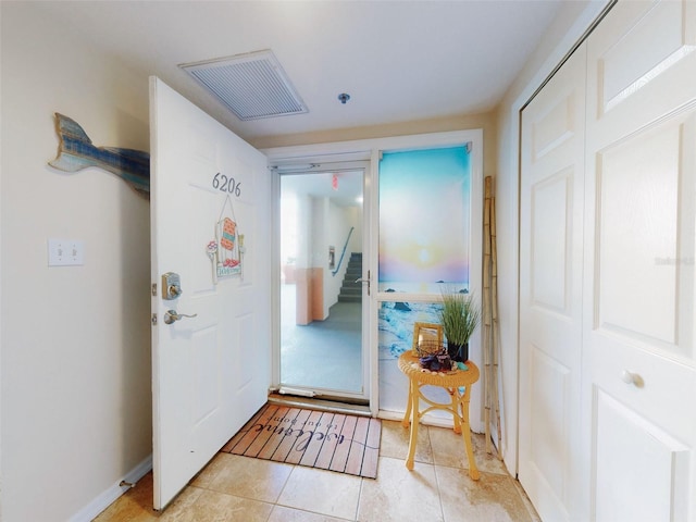 view of tiled foyer entrance