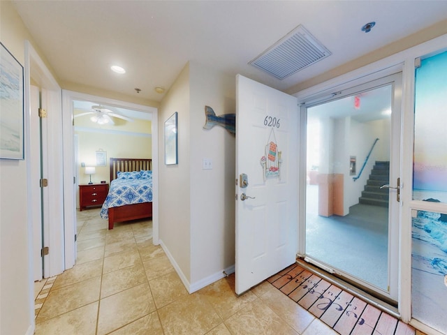 interior space with ceiling fan and light tile patterned floors