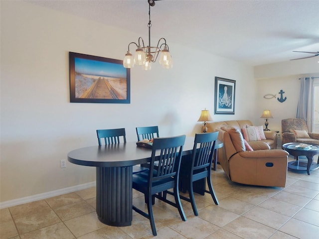 dining room with light tile patterned flooring and a notable chandelier