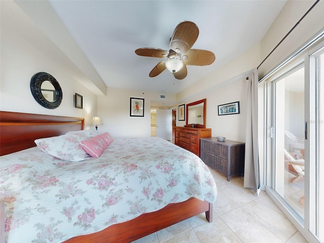 tiled bedroom featuring ceiling fan