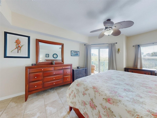 tiled bedroom with multiple windows, access to exterior, and ceiling fan