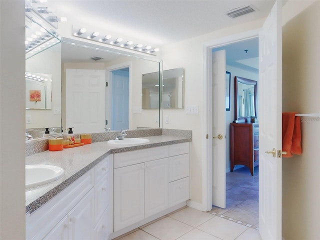 bathroom featuring vanity and tile patterned flooring