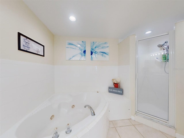 bathroom with tile patterned floors and plus walk in shower