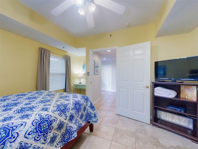 bedroom featuring ceiling fan and light tile patterned flooring