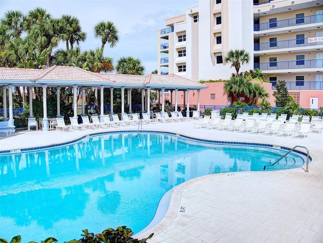 view of pool featuring a patio