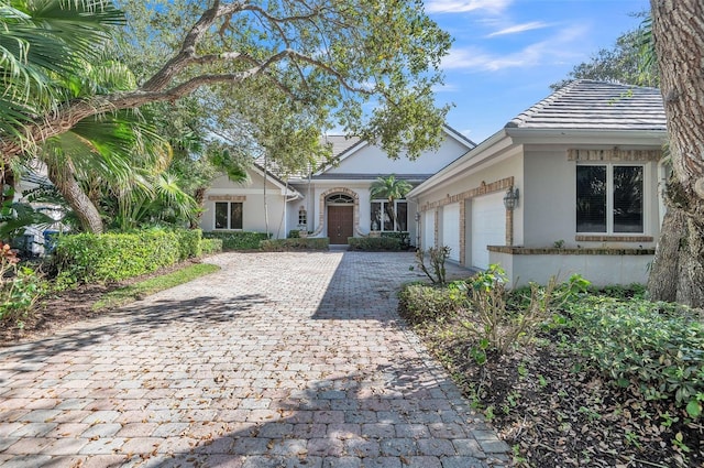 single story home featuring a garage