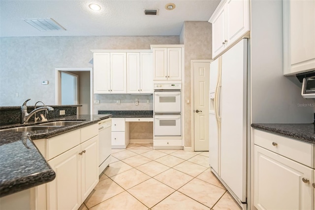 kitchen featuring white cabinetry, white appliances, and sink