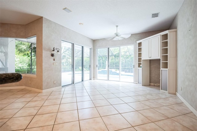 interior space featuring a textured ceiling and ceiling fan