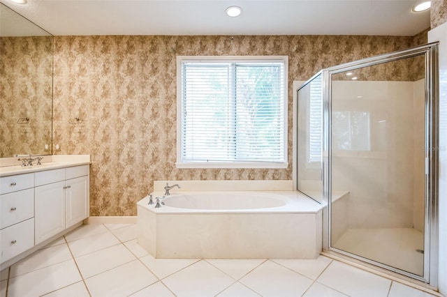 bathroom with vanity, tile patterned floors, and plus walk in shower