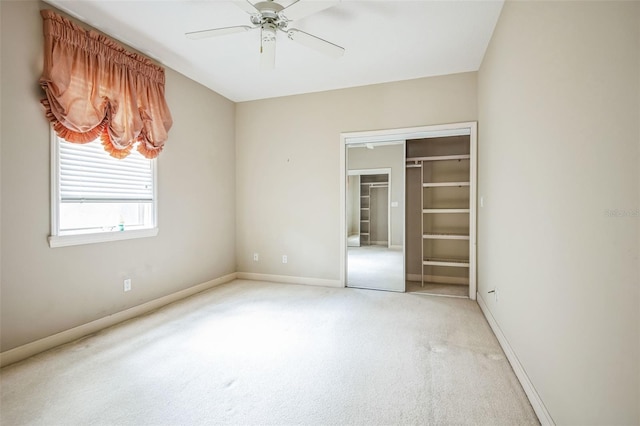 unfurnished bedroom with light carpet, a closet, and ceiling fan