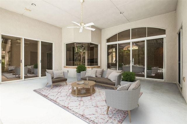 view of patio with an outdoor living space and ceiling fan