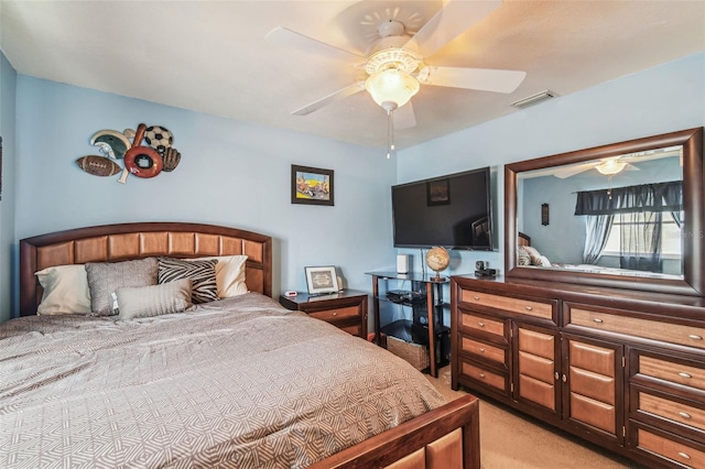 bedroom with ceiling fan and light colored carpet