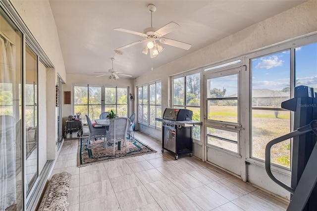 sunroom / solarium featuring lofted ceiling