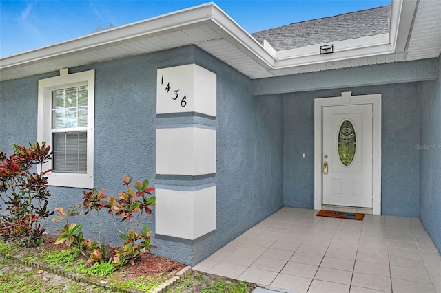 property entrance with a patio