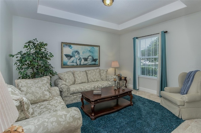 619 Meadow Sage Dr, Deland, FL 32724 - living room featuring a raised ceiling and light tile patterned floors