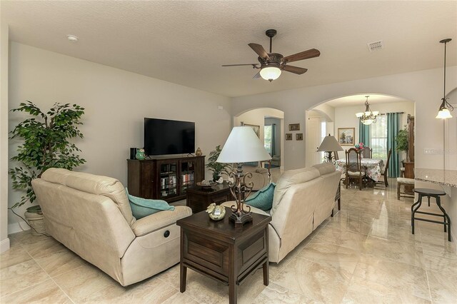 619 Meadow Sage Dr, Deland, FL 32724 - living room with a textured ceiling and ceiling fan