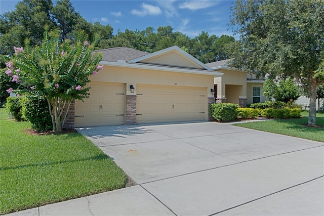 619 Meadow Sage Dr, Deland, FL 32724 - ranch-style house with a garage and a front yard
