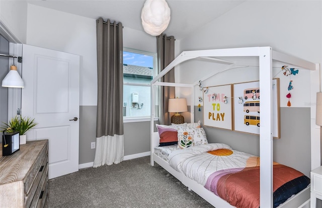 carpeted bedroom featuring lofted ceiling