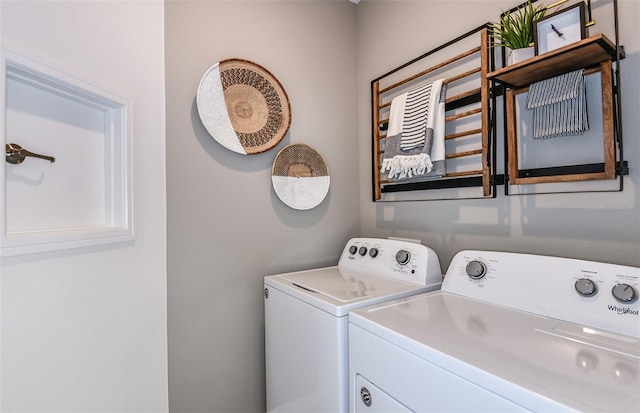 washroom featuring washer and dryer