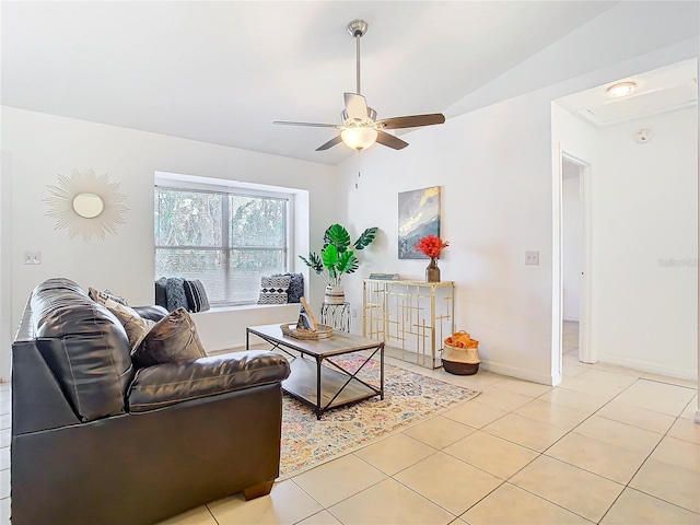 living room featuring light tile patterned flooring, ceiling fan, and lofted ceiling