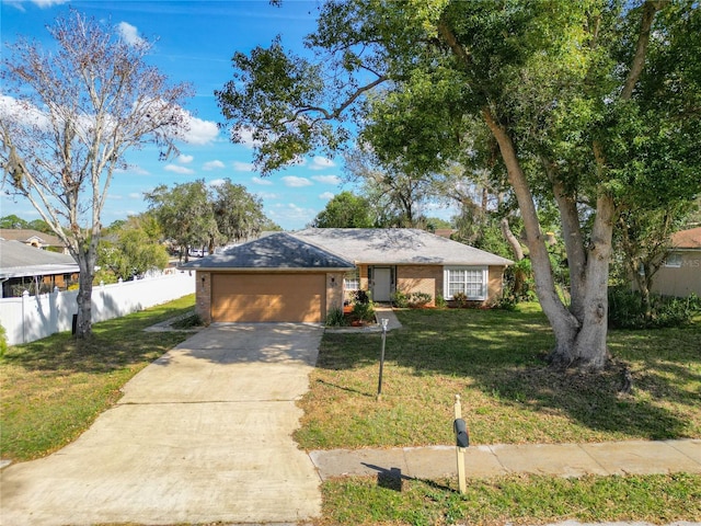 ranch-style house with a garage and a front lawn