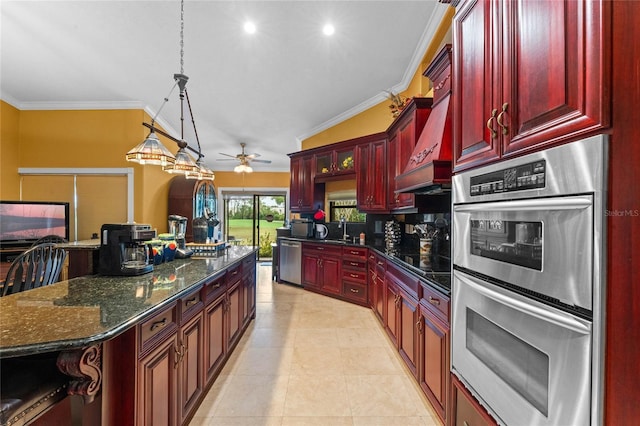 kitchen with pendant lighting, dark stone countertops, a breakfast bar area, ornamental molding, and stainless steel appliances