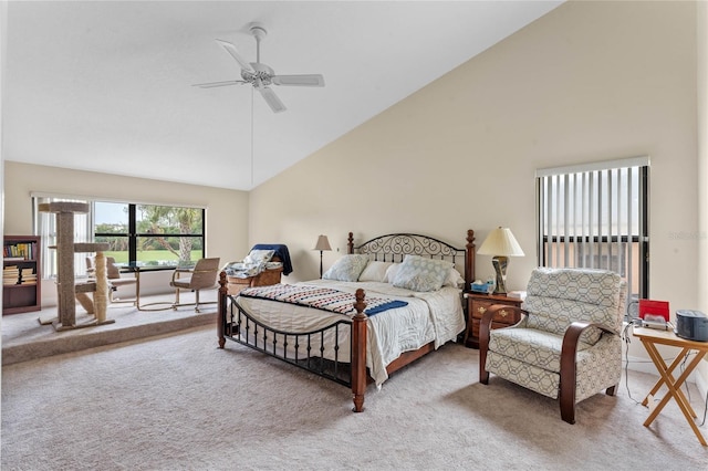 bedroom with ceiling fan, carpet flooring, and high vaulted ceiling