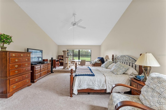 bedroom with high vaulted ceiling and light colored carpet