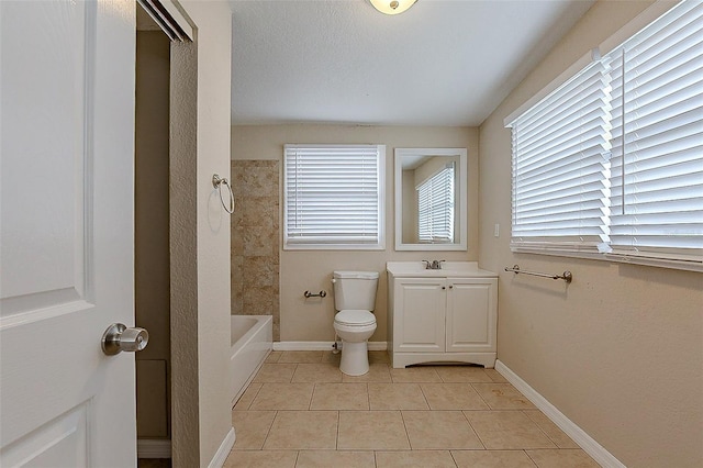 bathroom with toilet, tile patterned flooring, baseboards, and vanity