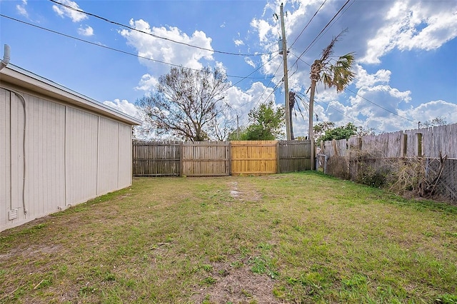 view of yard with a fenced backyard