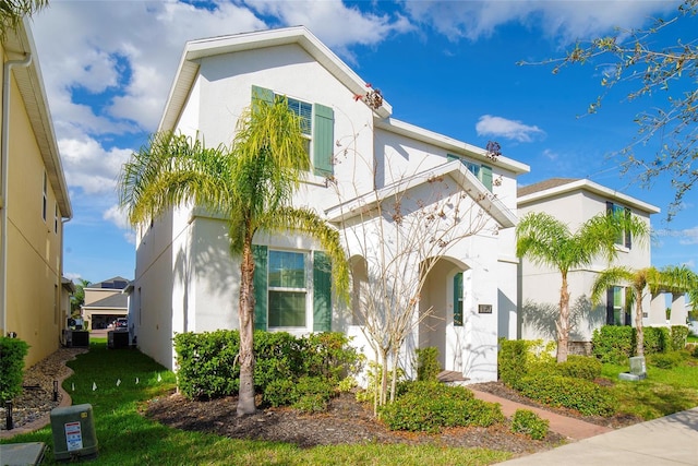 mediterranean / spanish-style house featuring central AC unit