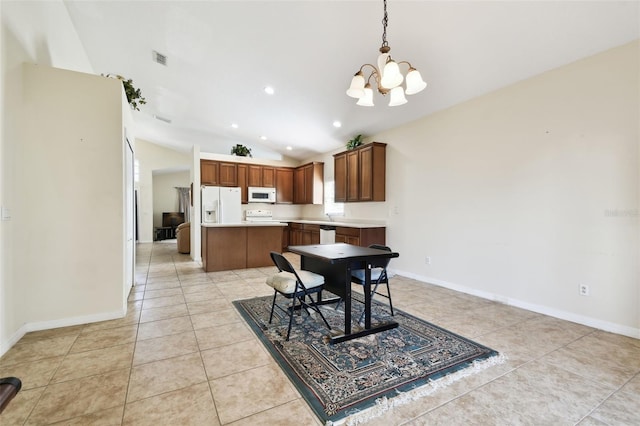 tiled dining area with a chandelier and vaulted ceiling