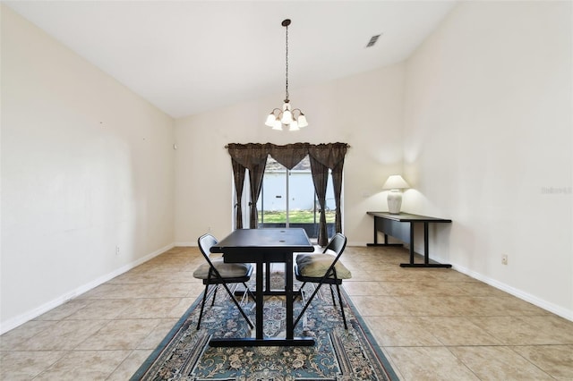 dining area with light tile patterned floors, a notable chandelier, and high vaulted ceiling