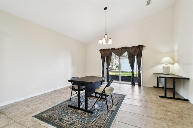 tiled dining area featuring a notable chandelier and high vaulted ceiling