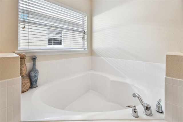 bathroom with tiled tub