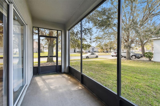 unfurnished sunroom with a healthy amount of sunlight