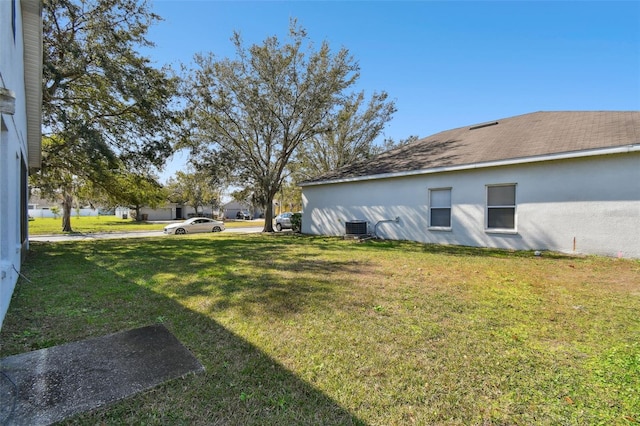 view of yard with central AC