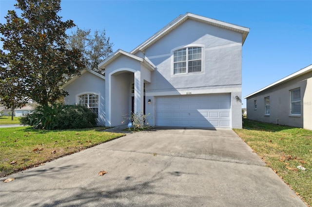 front of property with a garage and a front yard