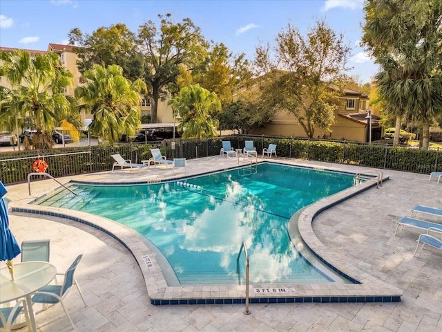 view of swimming pool featuring a patio