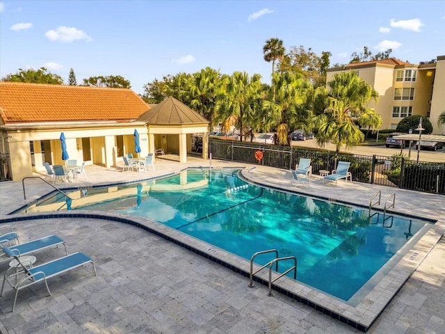 view of pool featuring a patio area