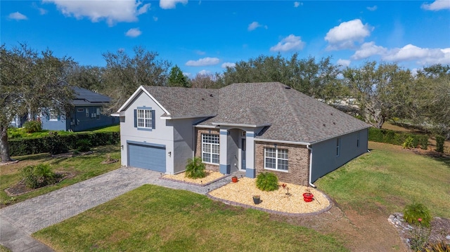 view of front of home featuring a garage and a front yard