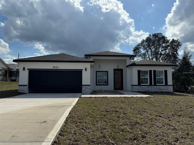 4650 SW 139th Pl, Ocala, FL 34473 - prairie-style house with stucco siding, driveway, stone siding, a front yard, and a garage
