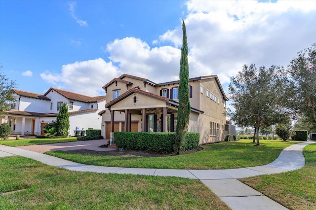 mediterranean / spanish-style house with a front lawn