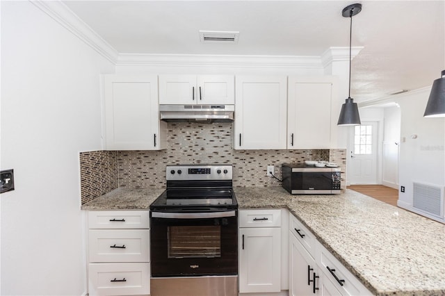 5508 Meridian Way, Orlando, FL 32808 - kitchen with tasteful backsplash, crown molding, stainless steel appliances, under cabinet range hood, and visible vents