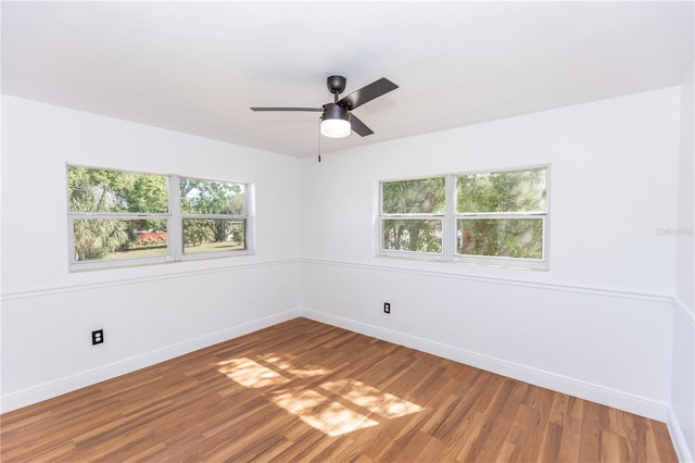 5508 Meridian Way, Orlando, FL 32808 - spare room with baseboards, a ceiling fan, and light wood-type flooring